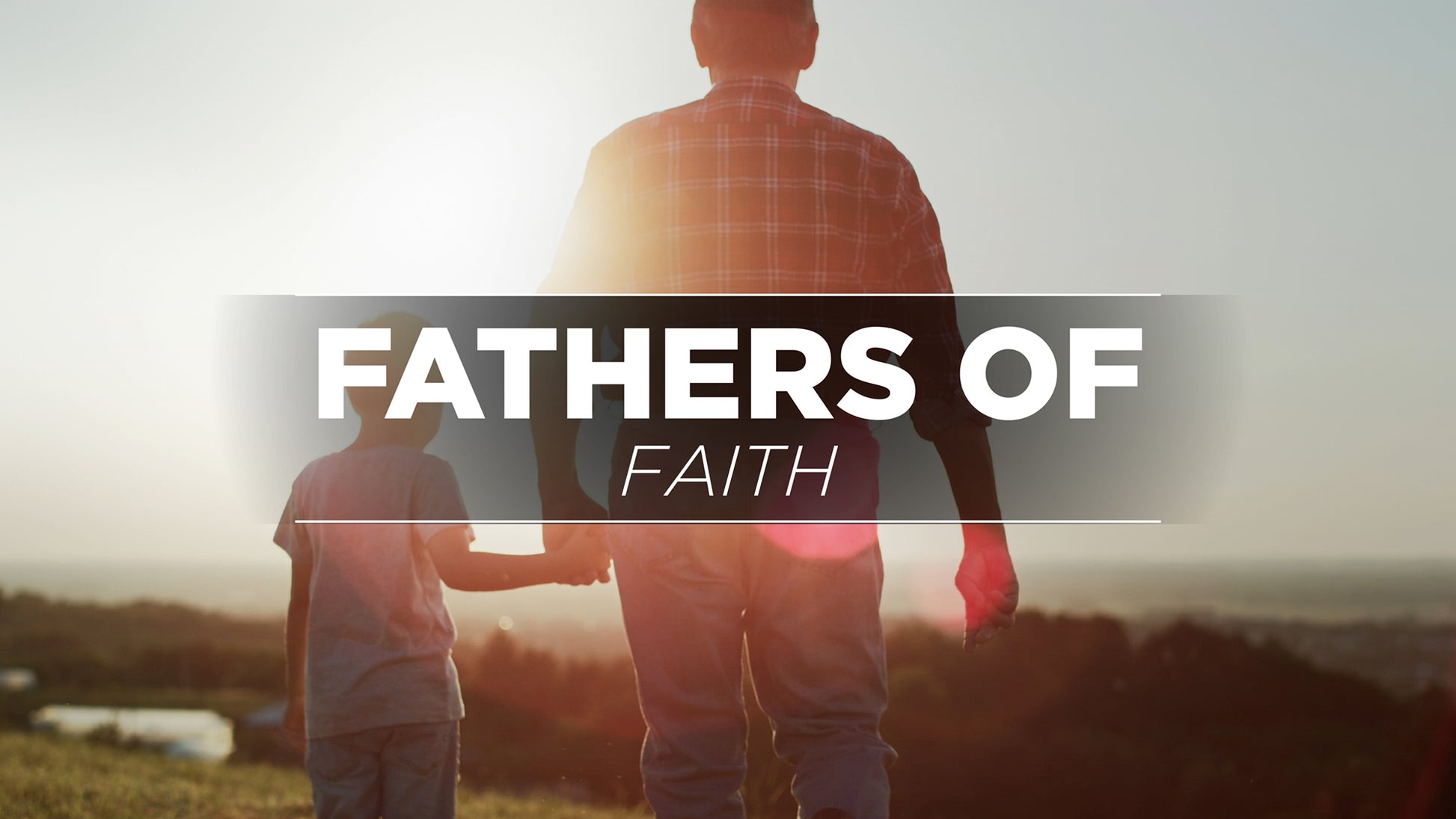 Two people walking together with 'Fathers of Faith' text overlay